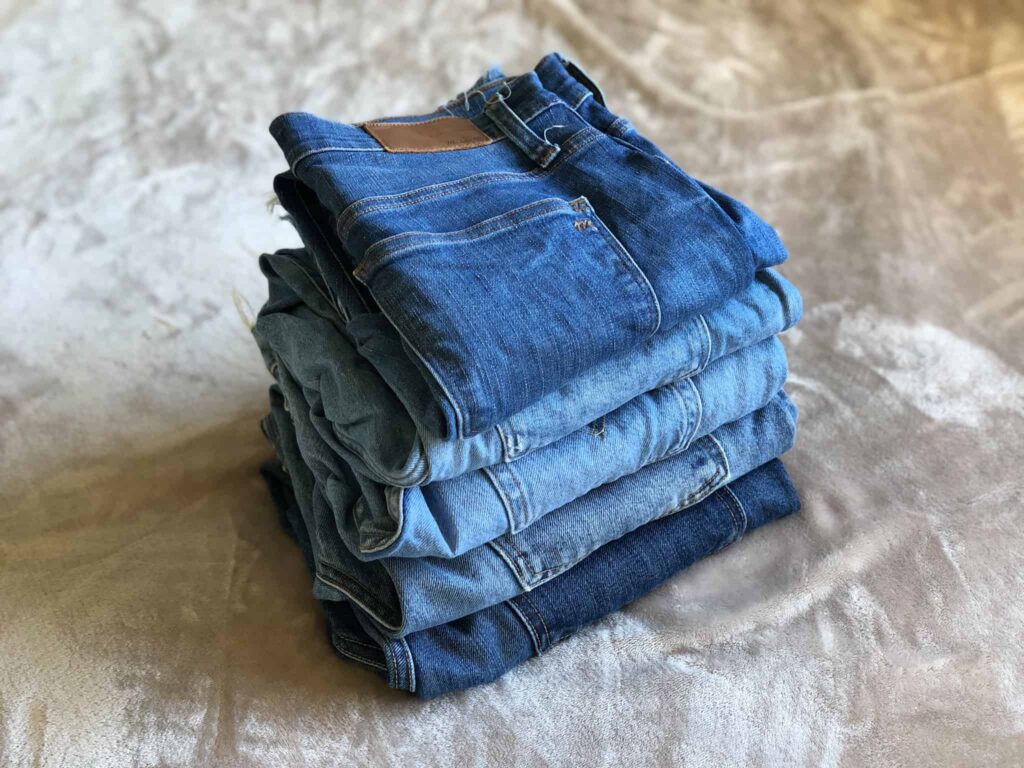Jeans folded on blanket